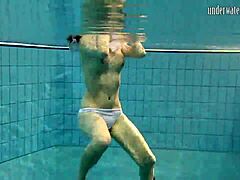 Russian teen Andrea enjoys an outdoor poolside swim