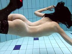 Juicy asses and natural tits on display in this underwater porn video