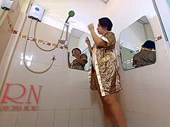 Candid bathroom striptease with a cute nude maid