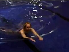 Hot girl in a sexy bikini by the swimming pool